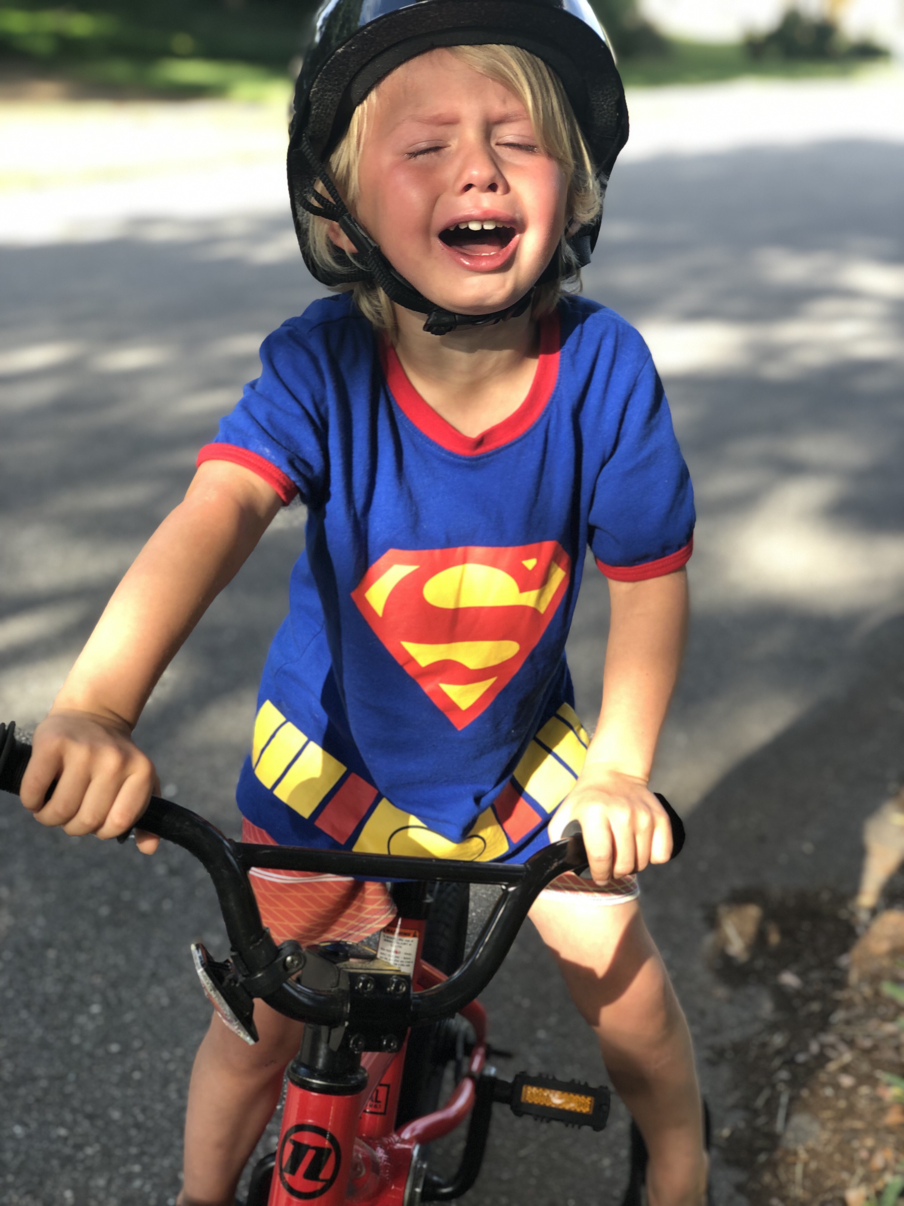 toddler crying on bike